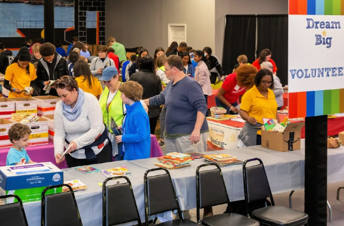 Dozens of volunteers help sort and pack books. at Book Harvest 2020