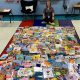 Rebecca Boyles with some of the 300 new books she was able to purchase with her Mebane Foundation first-year teacher grant.